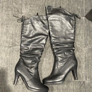 Black leather zip up high heel boots only wore a couple times